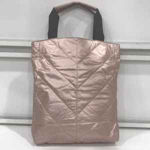 Metallic baby pink shoulder bag.